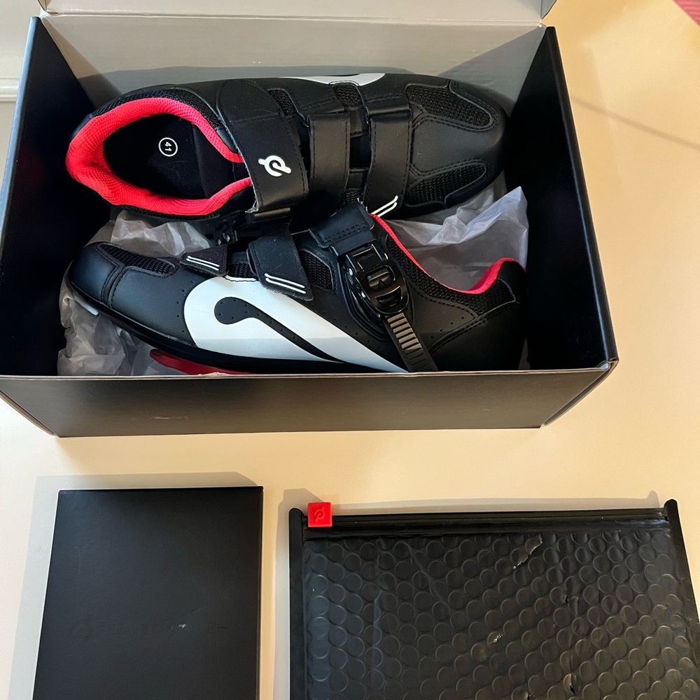 Peloton Bike+ Shoes, tools to adjust, decal,quick start guide, and user manual.